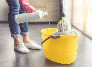 House cleaner mopping a floor
